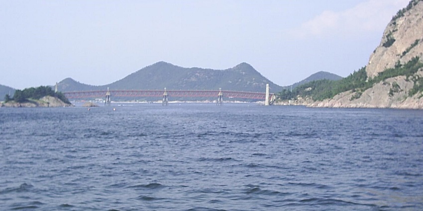 Park-covered Seonyudo Island in the Han River with modern urban views in the background.