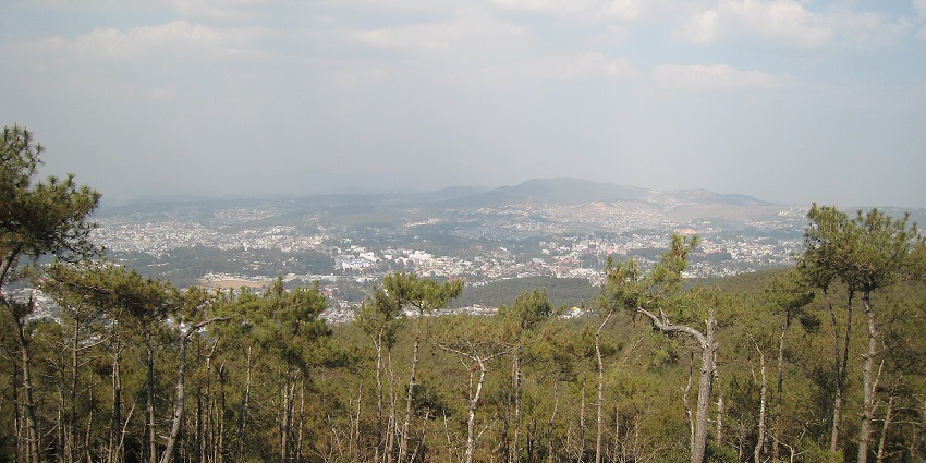 Shillong Peak viewpoint with distant buildings, houses in Shillong city and mountains