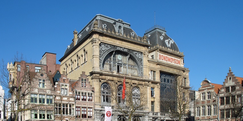 Shop at the Vrijdagmarkt in Ghent, a historic square filled with art and charming shops.