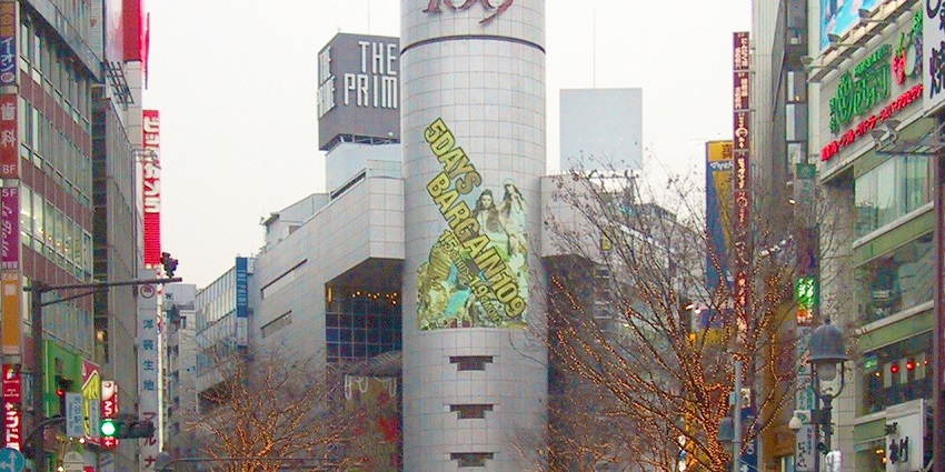 The iconic Shibuya 109 building in Tokyo stands tall with vibrant advertisements, symbolizing trendy shopping and attractions in Shibuya.