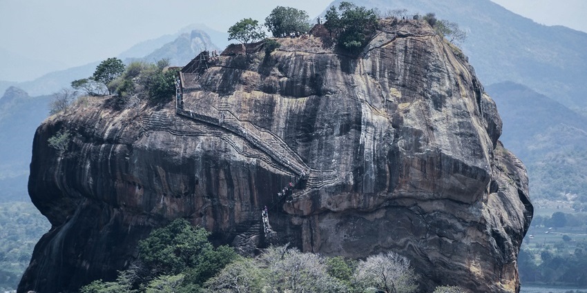 Majestic rock fortress rising above forested plains in Sigiriya is the top historical places in Dambulla
