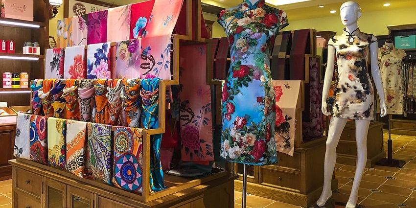 Elegant silk scarves with artistic prints in the boutique, Fabric Frontline Zurich.