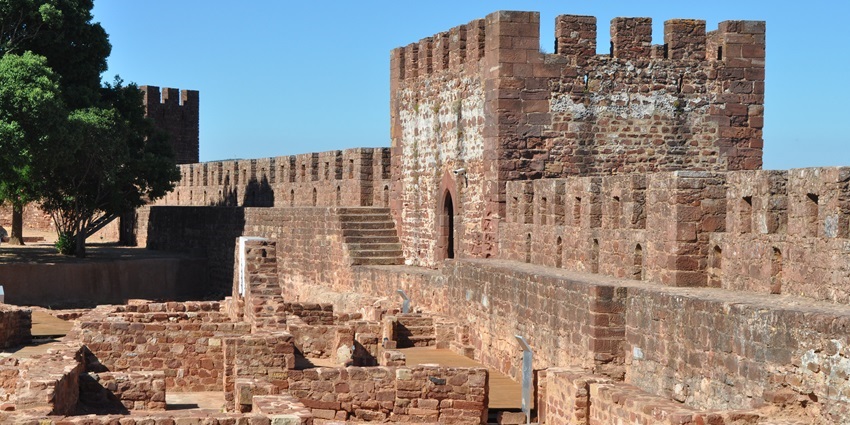 Aerial view of Silves Castle overlooking the town and hills.