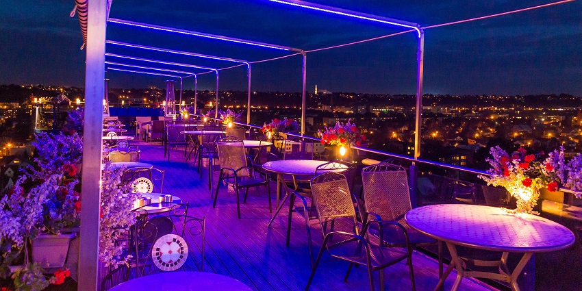 Stylish rooftop bar offering cocktails, pool views, and Dubai’s glittering night skyline.