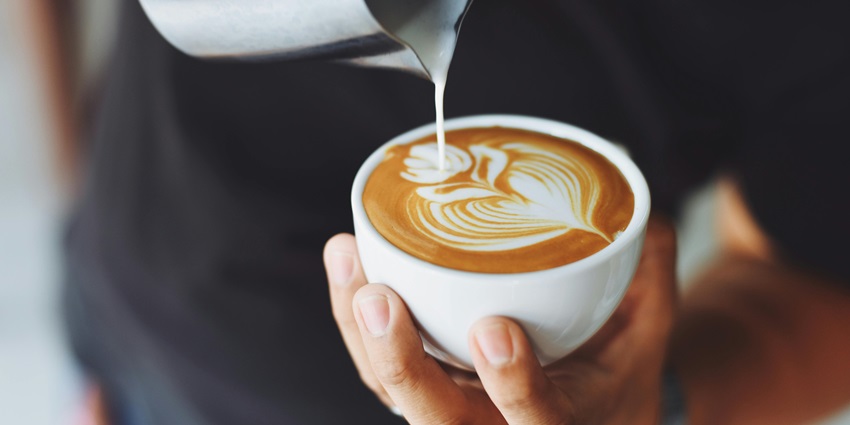 Caffè dell'Ussero features elegant vintage decor, wooden furniture, and a warm atmosphere.