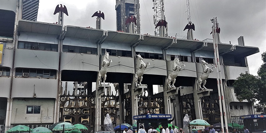 View of people standing in line at the ticket booth of the Tafawa Balewa Square monument.