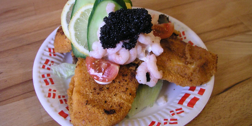 The traditional Smørrebrød served on rye bread, a classic example of food in Denmark.