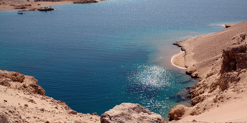 Snorkeling along scenic beaches and rugged cliffs is among the best things to do in Sharm El Sheikh