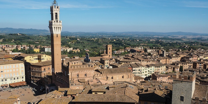 Piazza del Campo, home to the Palio race, offers stunning views from Torre del Mangia and Siena Cathedral.