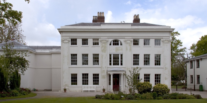 Exterior of Soho House with Georgian features and a peaceful courtyard.