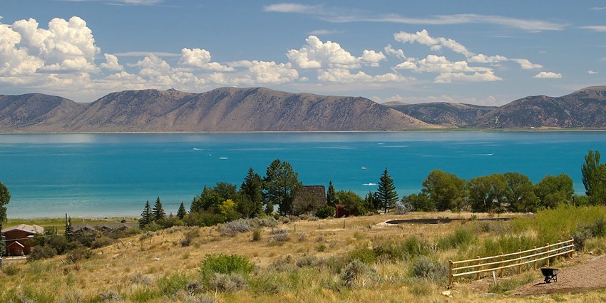 Beachgoers enjoy water sports in Bear Lake, often called the “Caribbean of the Rockies.”