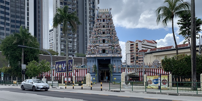 The tower of the temple is adorned with statues of deities and mythological figures.