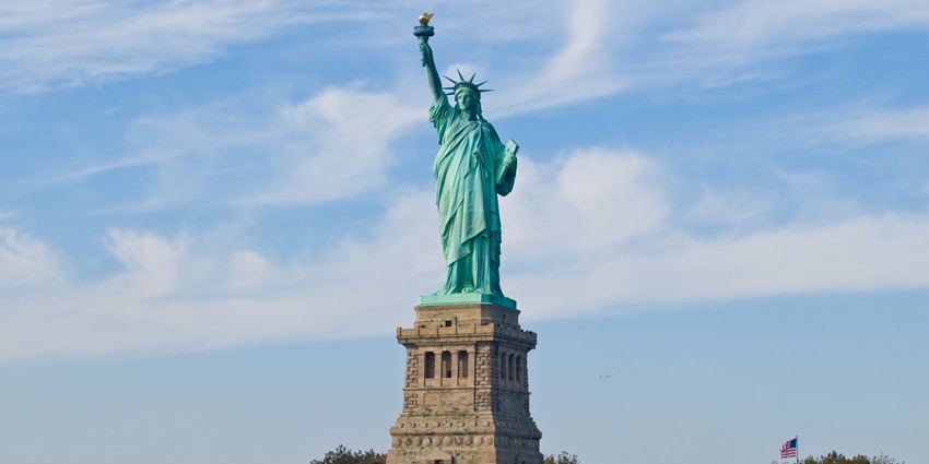 The iconic green copper statue of Lady Liberty, overlooking New York, monument in the USA