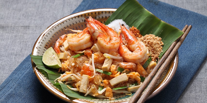 Pad Thai popular street food, Original thai food on a dark background and copy space.