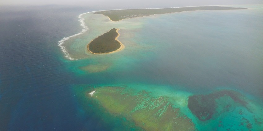 Ha‘apai Islands with small sandy beaches, palm trees, and turquoise South Pacific waters.