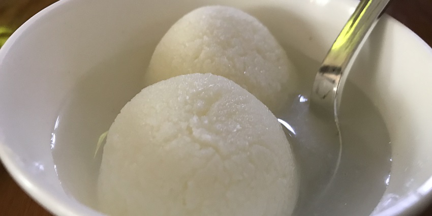 Traditional Bengali sweets display showing what is the main food of Kolkata to buy