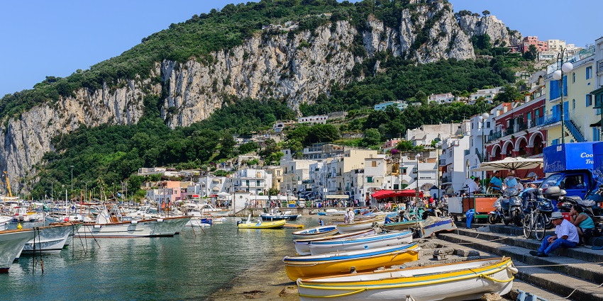Sail to the island of Capri to explore its stunning grottoes, chic boutiques, and rugged coastline, among the best things to do in Sorrento.