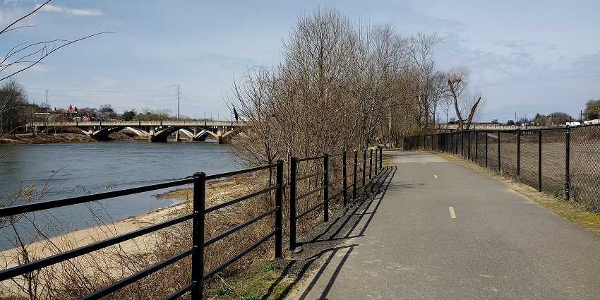 Enjoy scenic river views and lush greenery along this tranquil, paved walking trail.