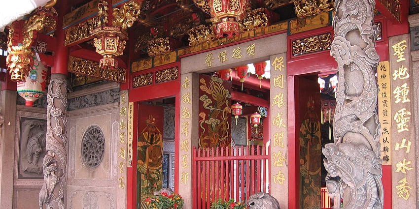 A traditional Chinese temple with green-tiled roofs, one of the monuments in Singapore.