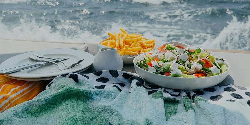 A plate of fresh seafood, including shrimp, is on the list of what is Madrd famous for.