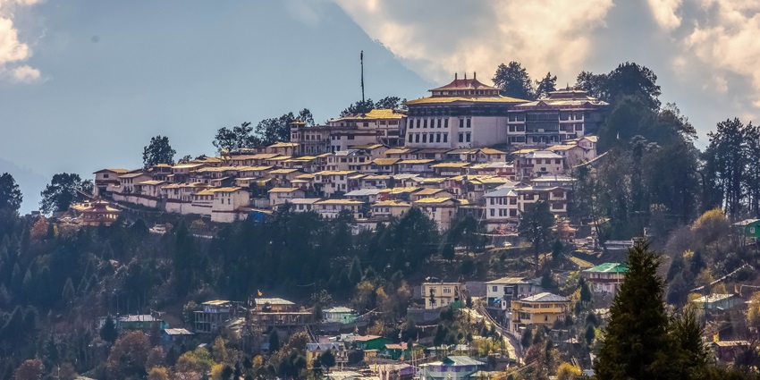 Tawang Monastery with old traditional architectural buildings, green trees and mountains