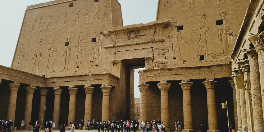 Front view of the Temple of Edfu in Egypt, showing large pylons with carved hieroglyphics.