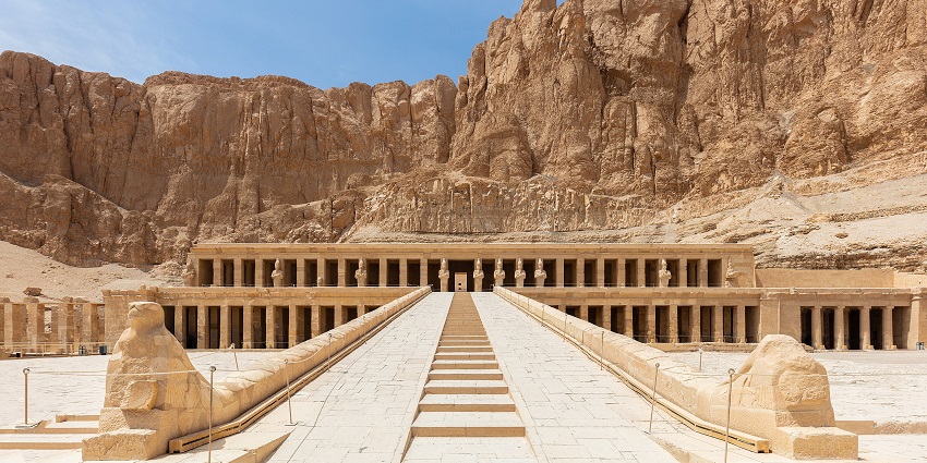 The Temple of Hatshepsut in Egypt, with grand colonnades set against a rugged cliff backdrop, one of the historical places in Egypt.