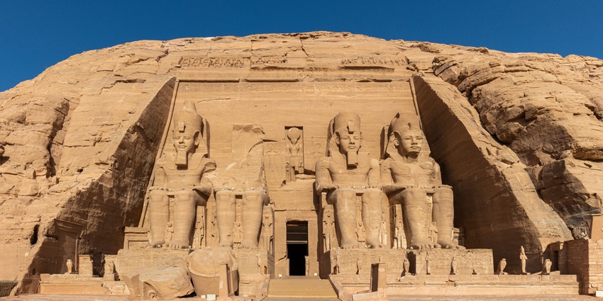 Twin rock temples featuring colossal statues of Ramses II, relocated above the Nile in southern Egypt.