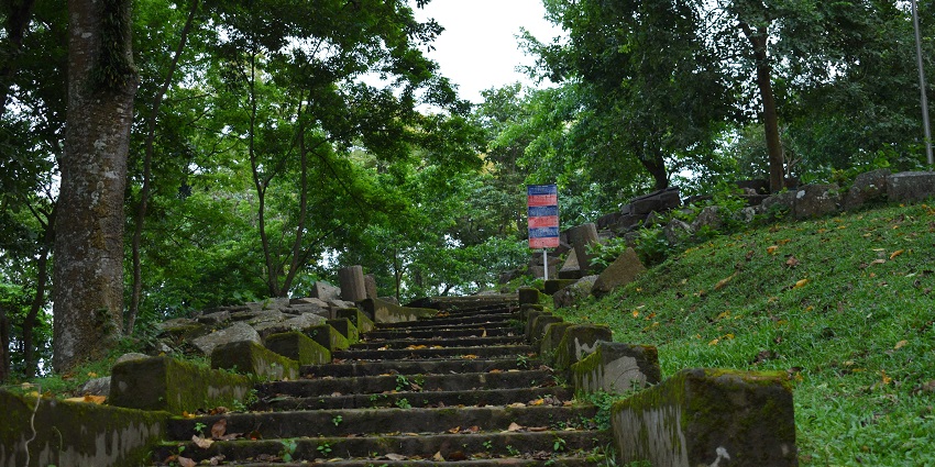 Steps leading to Bumani Hills in Tezpur, surrounded by lush greenery, one of the top places to visit in Assam in November.