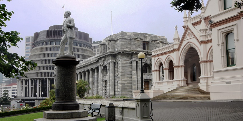 A panoramic view of New Zealand’s Parliament Buildings in Wellington, showcasing a blend of historic and modern architecture.
