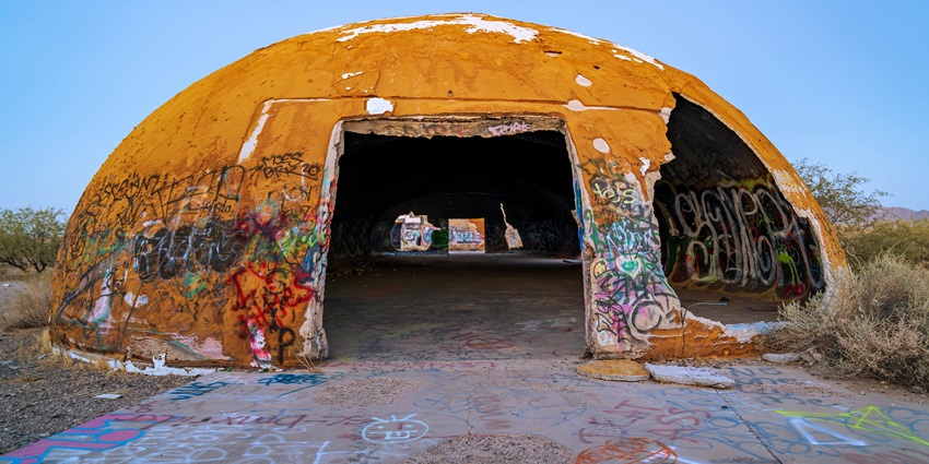 The domes of Casa Grande with multiple unique graffiti on the dome and an entrance gate