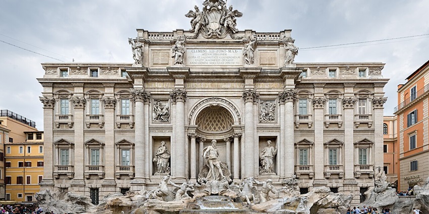 The Trevi Fountain with traditional architecture, detailed carvings and statues.