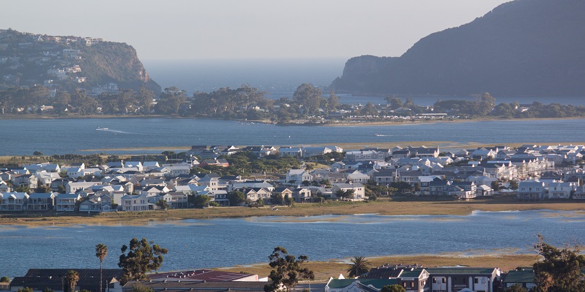 A view of waterfront villas and tranquil canals lined with boats on Thesen Island in Knysna.