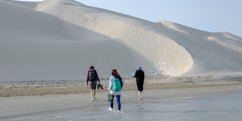 Tourists at one of the beaches on the island in Oman during their vacation.
