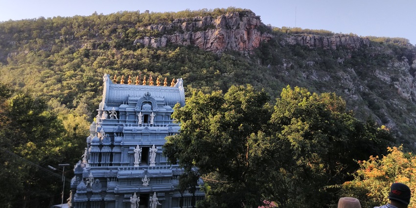 Tirumala Venkateswara Temple with a golden dome and scenic mountain view, Andhra Pradesh