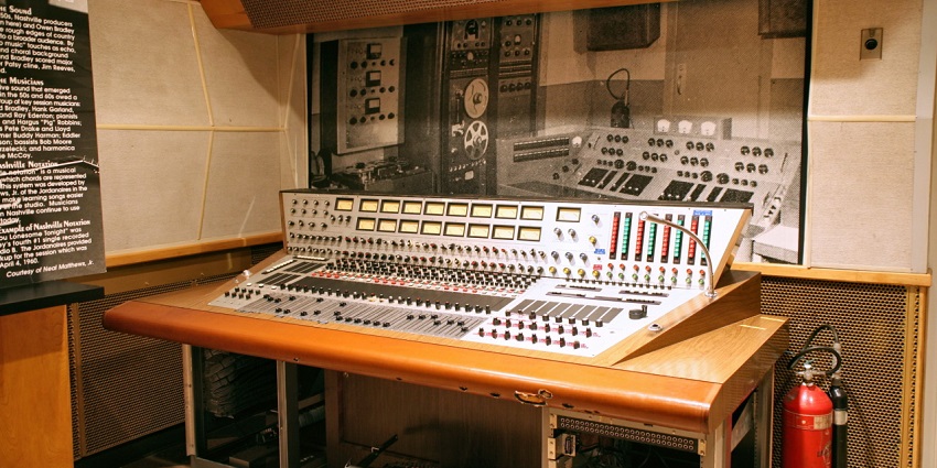 Audio mixing console at RCA Studio B, featuring knobs, capturing the essence of music production.