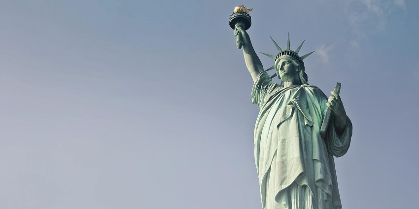 An image of Statue of Liberty in New York drawing millions of people, showcasing what is the most visited places in the United States.