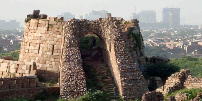 Tughlaqabad Fort ruins with broken walls and greenery, one of the best places to visit in Delhi in June
