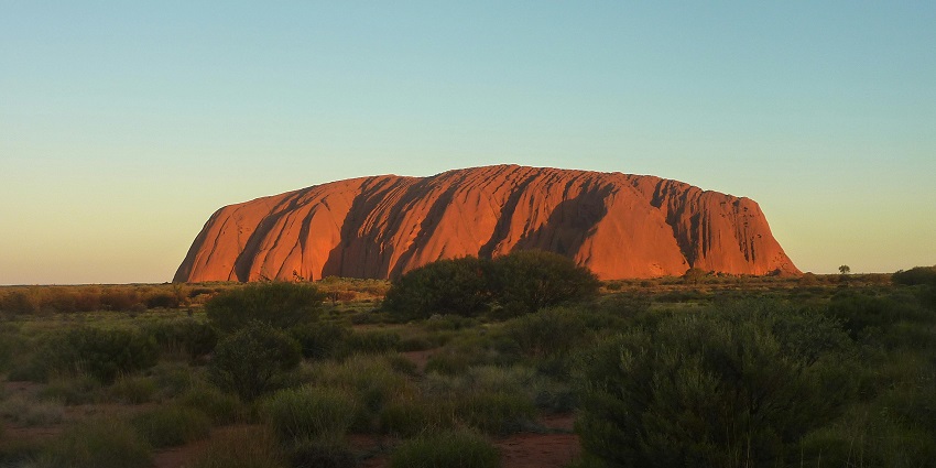 Majestic view of Uluru rock formation in the outback – what is Australia famous for.