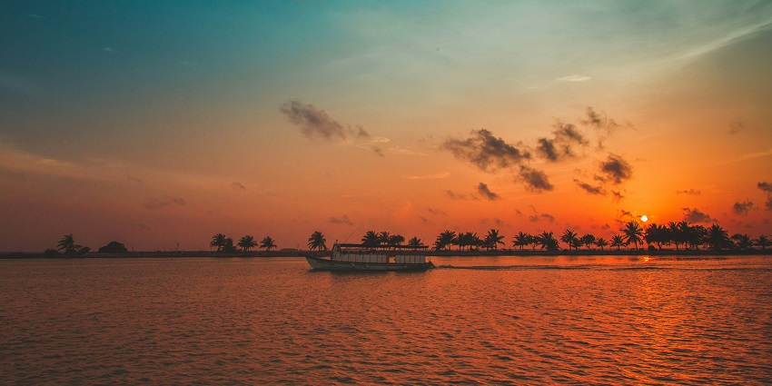 Sunset over calm ocean waters reflects the mood for 'Which Month Is Best to Visit Maldives'