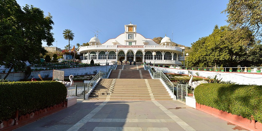 Universal peace hall with stairs leading to the white architectural building of the hall.