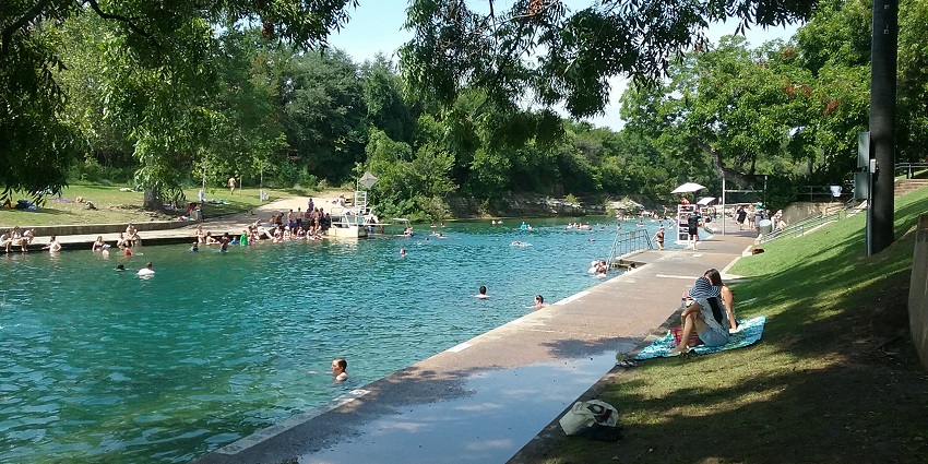 Taking a dip in Barton Springs Pool is one of the coolest things to do in Austin.