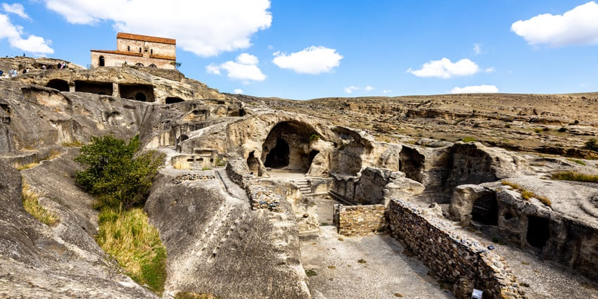 The cave city of Uplistsikhe is one of the must-visit ancient monuments in Georgia.