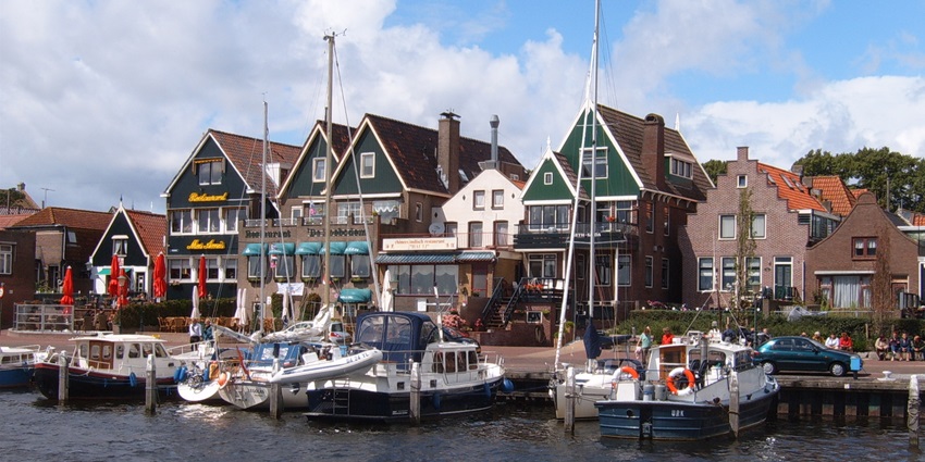 Fishing boats docked at Urk’s historic harbour, with the old town in the background.
