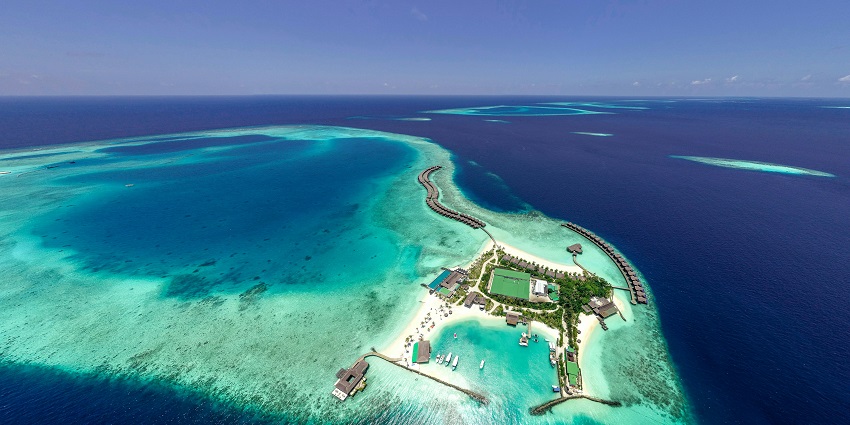 Witness the stunning bioluminescent beach on Vaadhoo Island, where glowing waves create a magical experience.