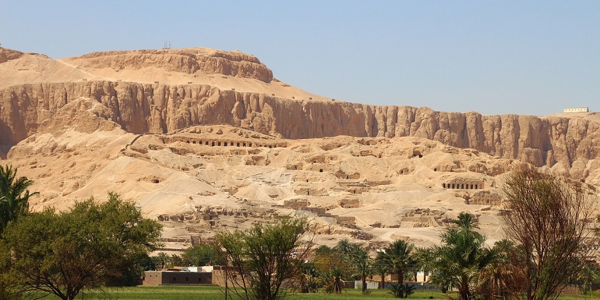 A scenic view of Egypt's Valley of the Kings, showing desert landscape and winding paths, one of the top historical places in Egypt.