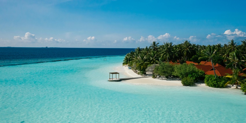 Indulge in the ultimate romance at Veligandu Island, featuring private beaches, clear lagoons, and luxurious villas.