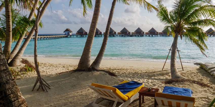 Veligandu Island Resort in the Maldives with resort buildings, wooden architecture