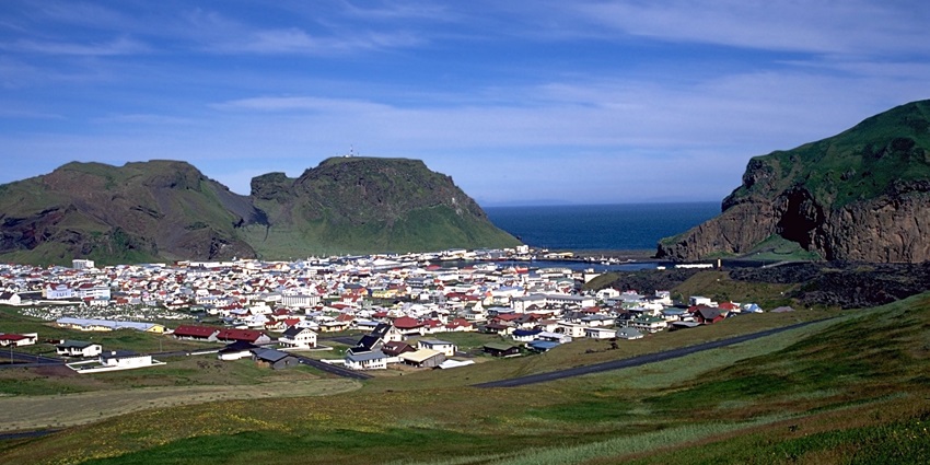 Explore puffin-covered cliffs and volcanic landscapes in the scenic Vestmannaeyjar island.