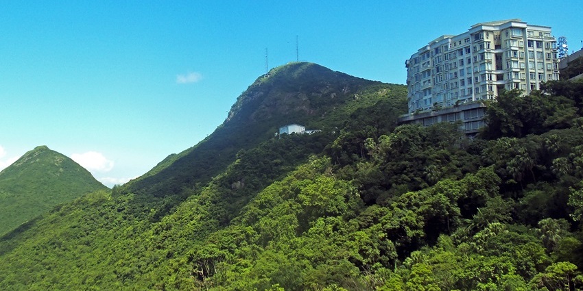 One of the Historical Places in Hong Kong, the Peak Tram and the old station with lush greenery.